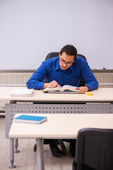 Fototapeta na wymiar Young male teacher in front of whiteboard