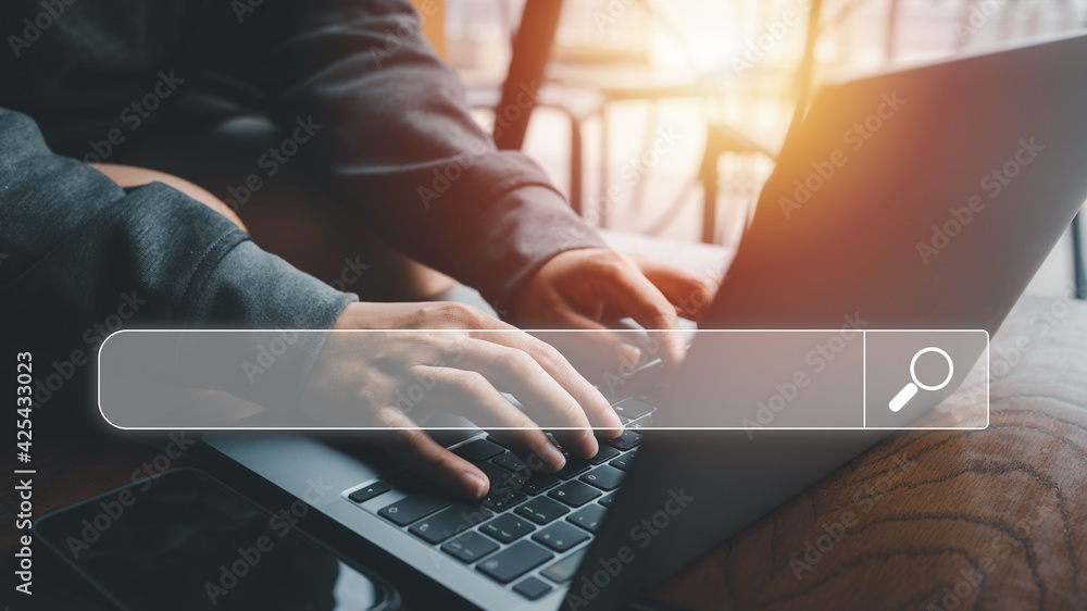 Poster Searching Browsing Internet Data Information Networking Concept, Human hand use laptop to search the internet, Searching engine with blank search bar, Search engine optimization, SEO