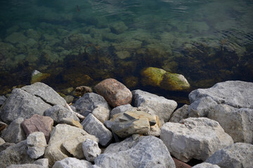 boulders or large rocks by a lake basin