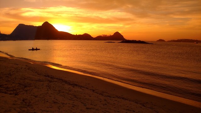 Sunset and Rio de janeiro view from Charitas beach by Christian Gintner