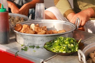 Street Food is ready-to-eat food or drink sold by a hawker, or vendor, in a street or other public place, such as at a market or fair.