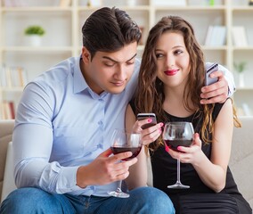 Young pair drinking wine in romantic concept