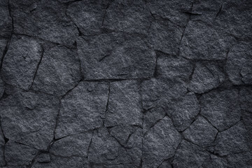 Dark grey slate stone or black stone wall texture background