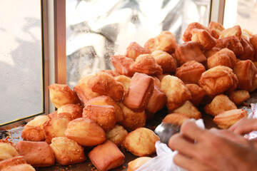 Bolang-baling is fried bread made from wheat flour with good taste, generally sold on the side of the road.