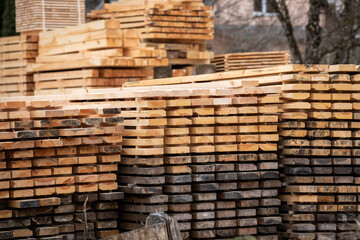 Sawn and stacked boards. Timber production, transportation and delivery