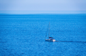 Obraz premium Sailing yacht in the blue calm sea.
