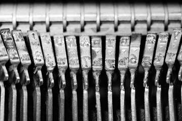 Close-up of typewriter striker keys in black and white