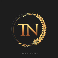 Initial logo letter TN with golden color with laurel and wreath, vector logo for business and company identity.