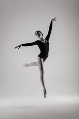 Fototapeta na wymiar Young ballet dancer isolated on white background