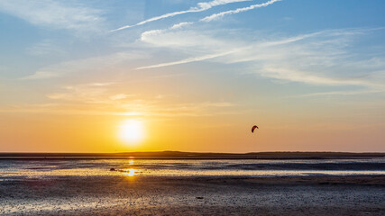 Kitesurfing with sunset