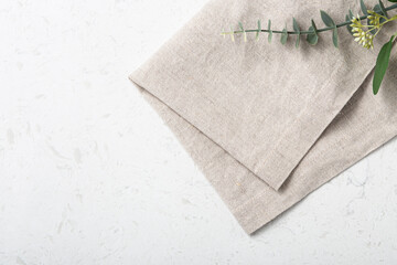 Folded linen napkin on marble table - obrazy, fototapety, plakaty