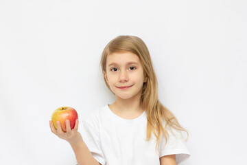 Fototapeta na wymiar Portrait of cute little girl holding an apple - isolated on white.