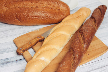fresh loaves on a breadbasket on the table breakfast 