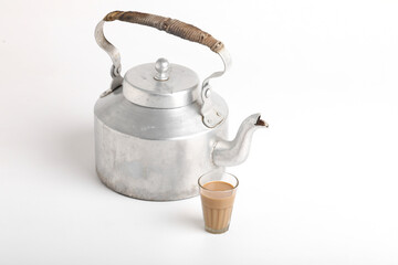 aluminum tea pot or kettle with rusk on white background.
