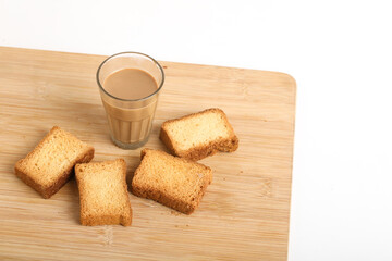 rusk with cup of tea with wood background