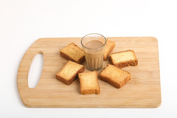 Fototapeta na wymiar rusk with cup of tea with wood background