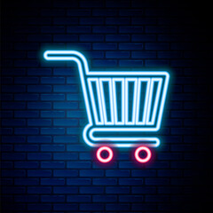 Glowing neon line Shopping cart icon isolated on brick wall background. Online buying concept. Delivery service sign. Supermarket basket symbol. Colorful outline concept. Vector