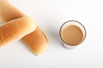 Famous breakfast. Tea and Bun on wooden background