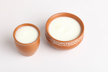 Pouring homemade kefir, yogurt with probiotics Probiotic cold fermented dairy drink Trendy food and drink Copy space Rustic style.