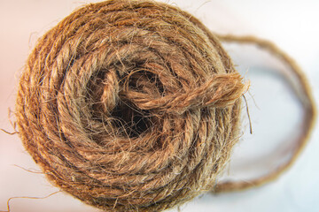 Natural Jute Twine Roll, top view on white background. 