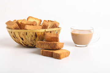 Rusk or bread toast with cup of tea on white background.