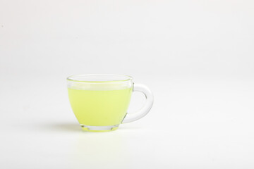 green tea with lemon on white background.