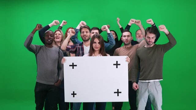 Protest movement, female activist holding a protest poster, a protesting crowd in the background, people shouting and sconding, template on a chromakey.