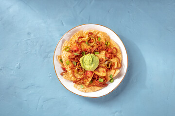 Nachos with meat and guacamole, top shot