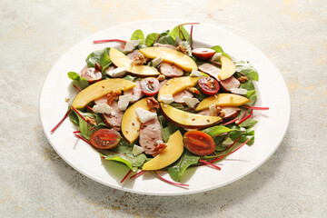 Plate of fresh mango salad on light background