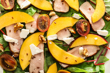 Fresh mango salad with bacon as background
