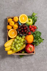 Assorted fresh fruits in a wooden box