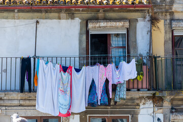 Clotheslines for dry clothes outside a windows in an old town