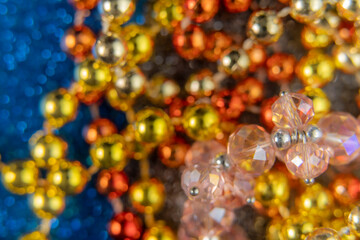 Close up of bright colorful beads necklaces. Macro holiday background