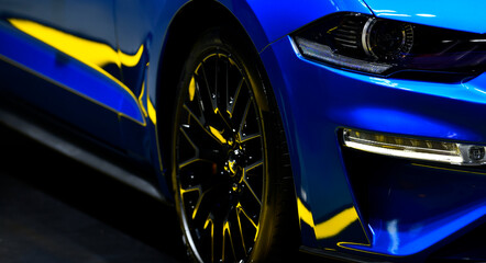 Front headlights of blue modern car background