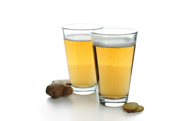 Glasses of ginger beer isolated on white