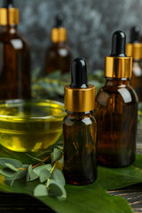 Concept of natural cosmetics with eucalyptus oil on wooden table