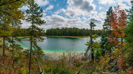 The crystal clear McGinnis Lake with its distinct green and blue colors in Petroglyphs Provincial Park located in Ontario, Canada.