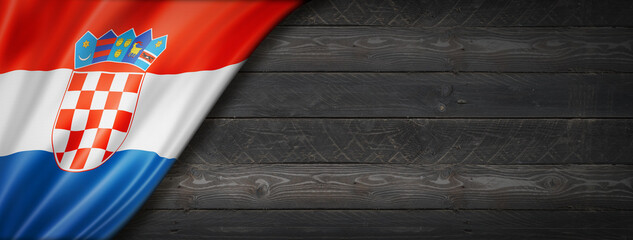 Fototapeta premium Croatian flag on black wood wall banner