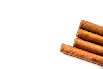 Group of brown cuban cigars isolated on white
