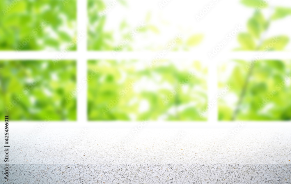 Poster empty terrazzo table top on blur green leaf garden from window view in the morning. for product disp