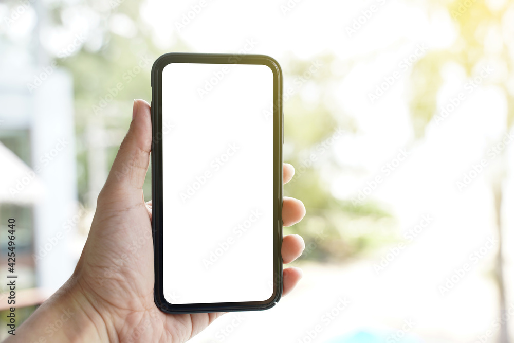 Poster mockup of blank screen mobile phone. man hand holding and using a mobile phone with white blank scre