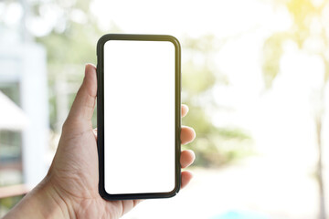 Mockup of blank screen mobile phone. Man hand holding and using a mobile phone with white blank...