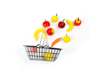 in the shopping basket  the supermarket flying fruit apples, pears, bananas, on a white background...