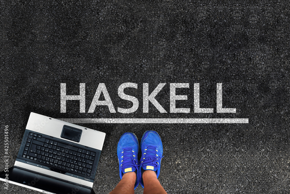Poster haskell programming language. man legs in sneakers standing next to laptop and word haskell