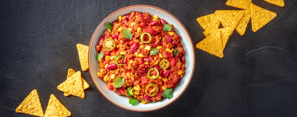 Mexican menu panoramic banner with chili con carne and nachos, top shot