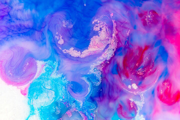 Abstract Shades in a wallpaper background. Multicolored beautiful oil paints in fantastic motion. Chaotic Movement of blue, red and magenta, and black colors.