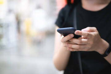 Unrecognizable woman using a smartphone