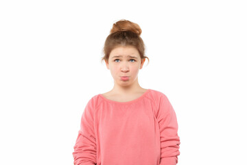 Sad teen girl standing alone feeling upset, frustrated and disappointed, looking at camera, has innocent expression