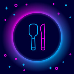 Glowing neon line Knife and spoon icon isolated on black background. Cooking utensil. Cutlery sign. Colorful outline concept. Vector