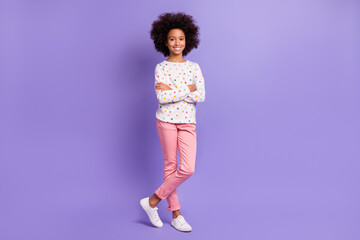 Full length photo of small afro american girl folded hands good mood isolated on purple color background
